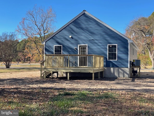 back of property featuring a deck and central air condition unit