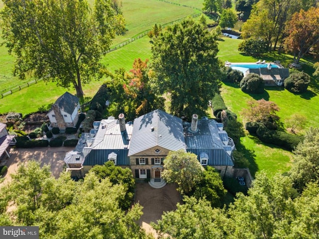 birds eye view of property with a rural view