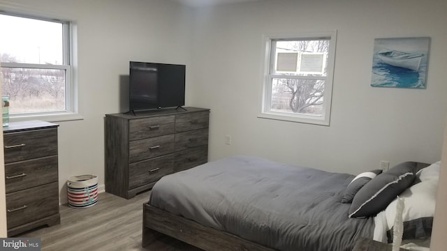 bedroom with light wood-type flooring