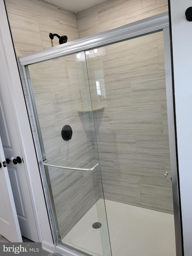 bathroom with an enclosed shower