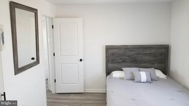 bedroom featuring hardwood / wood-style flooring