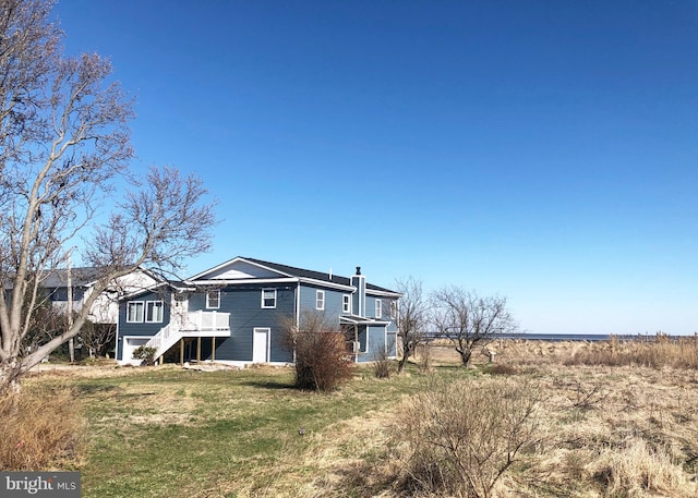 view of side of property with a yard