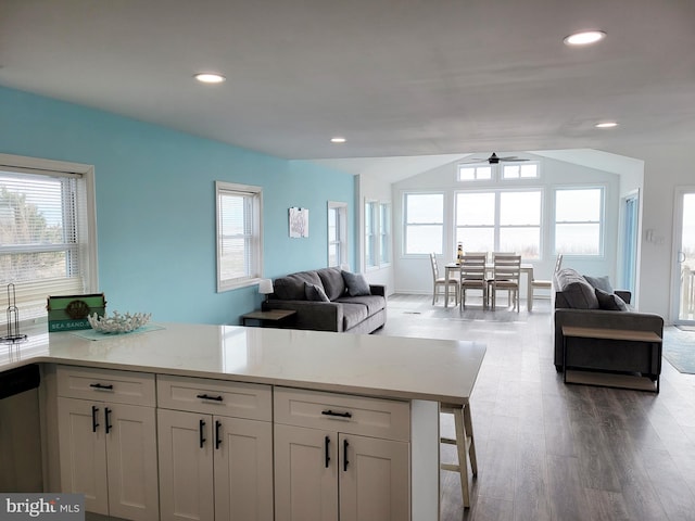 kitchen with ceiling fan, white cabinetry, and a wealth of natural light