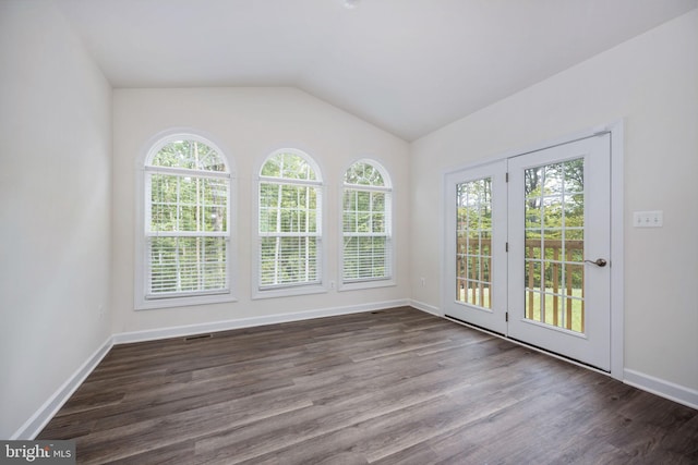 unfurnished sunroom featuring vaulted ceiling