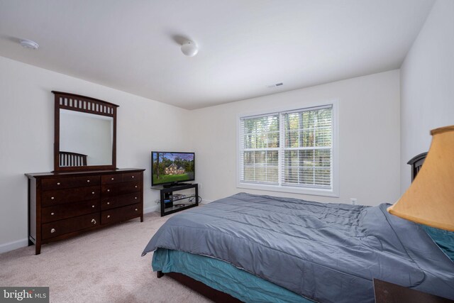 bedroom with light colored carpet