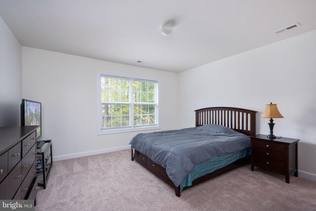 bedroom with light carpet