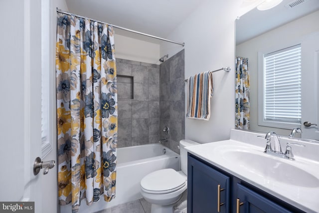 full bathroom featuring vanity, tile patterned floors, toilet, and shower / bathtub combination with curtain