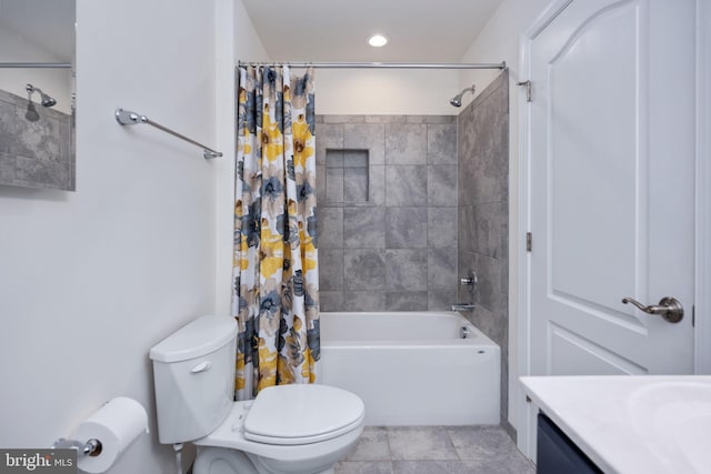 full bathroom with vanity, shower / bath combination with curtain, toilet, and tile patterned floors