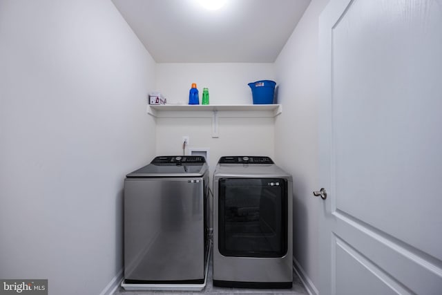 laundry area featuring washing machine and clothes dryer