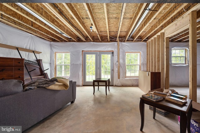 living room with concrete floors and plenty of natural light