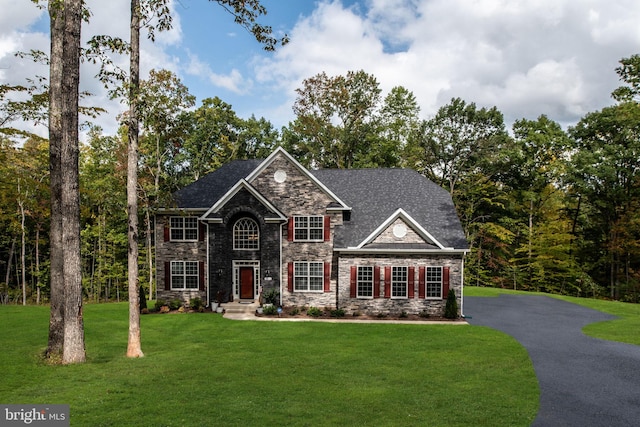 view of front of home with a front yard