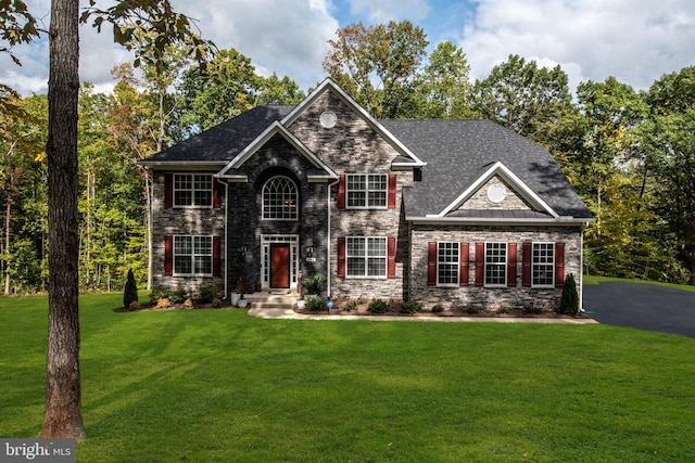 craftsman-style house with a front yard