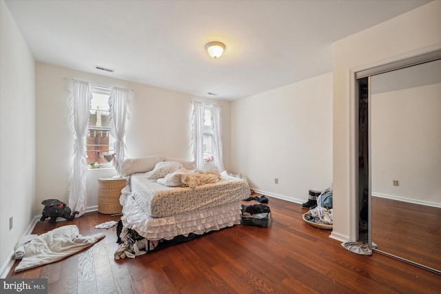 bedroom with hardwood / wood-style flooring