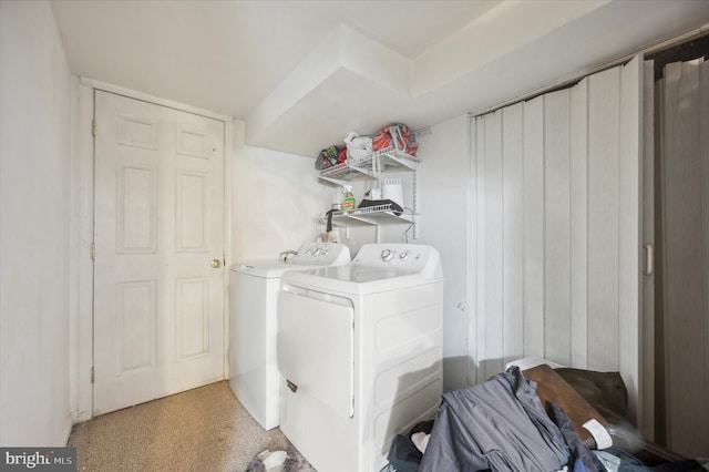 laundry area with separate washer and dryer