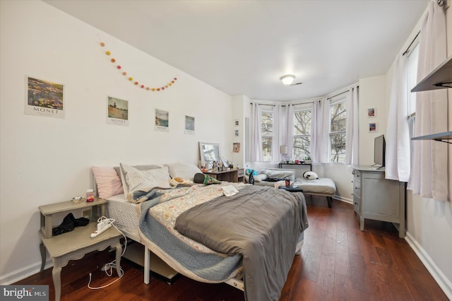 bedroom featuring dark wood-type flooring