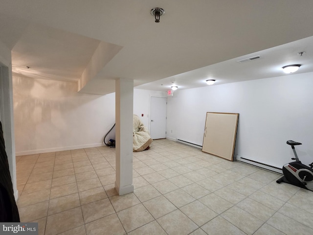 basement with light tile flooring and a baseboard radiator