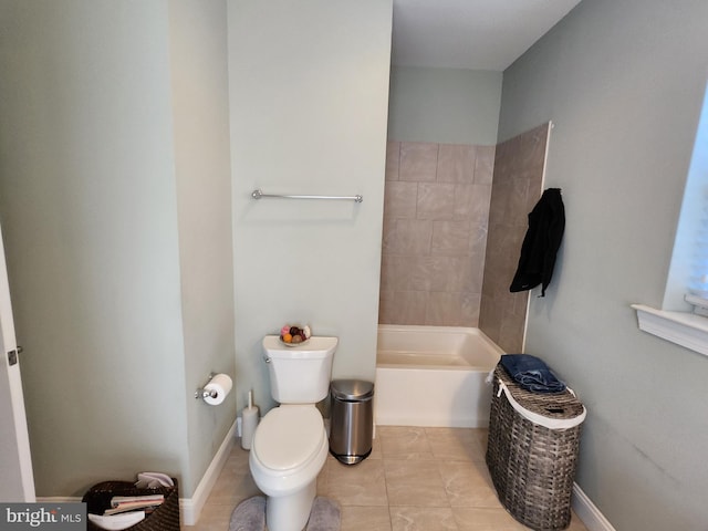 bathroom with tile flooring and toilet