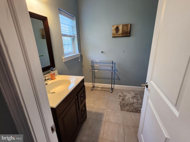 bathroom featuring tile floors and oversized vanity