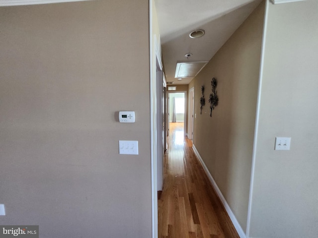 hallway featuring wood-type flooring