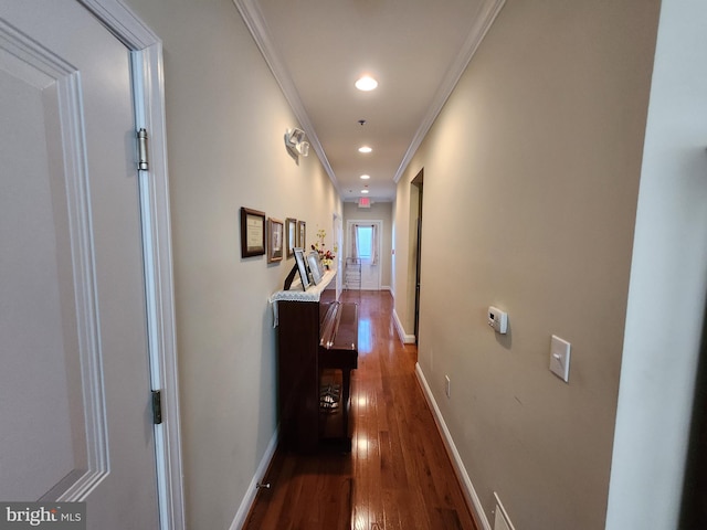 corridor featuring crown molding and dark hardwood / wood-style flooring