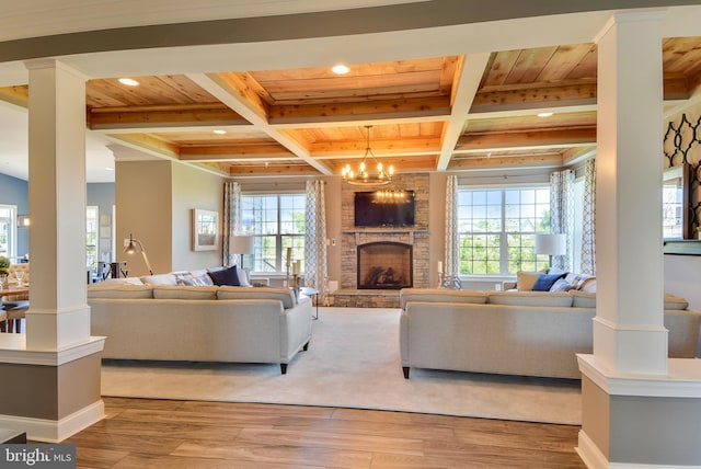 living room featuring a chandelier, wooden ceiling, light wood-type flooring, and beamed ceiling