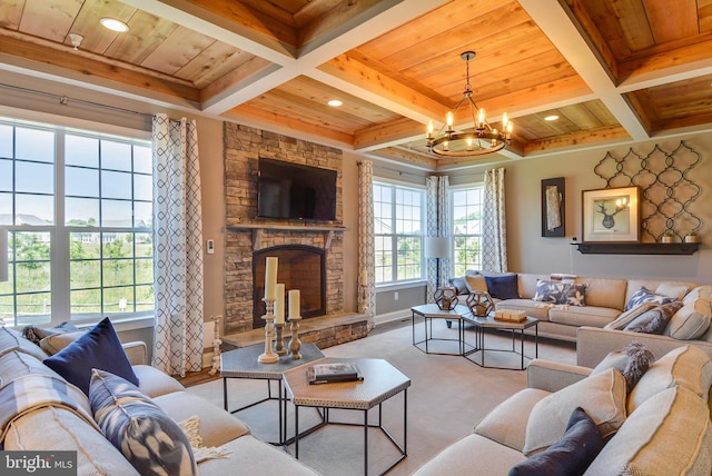 carpeted living room with a chandelier, beam ceiling, wood ceiling, and a fireplace