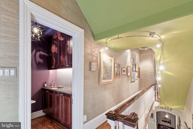 hall with dark hardwood / wood-style flooring and sink