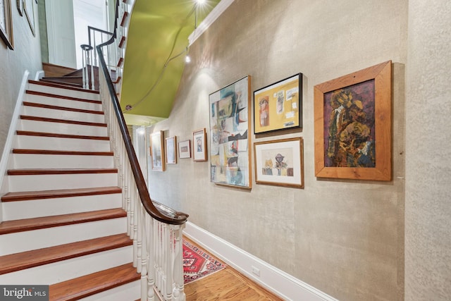 stairs featuring light hardwood / wood-style flooring