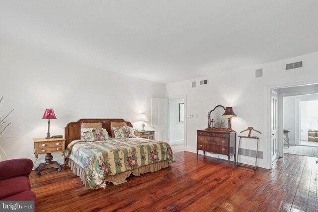 bedroom featuring dark wood-type flooring