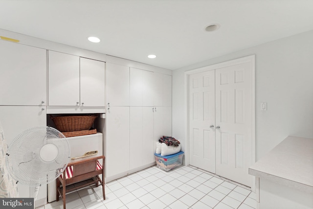 washroom with light tile floors