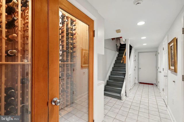 wine room featuring light tile floors