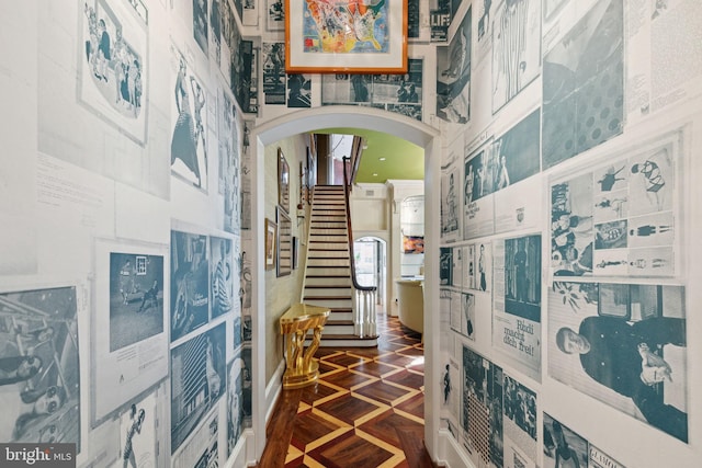 hallway with dark parquet flooring