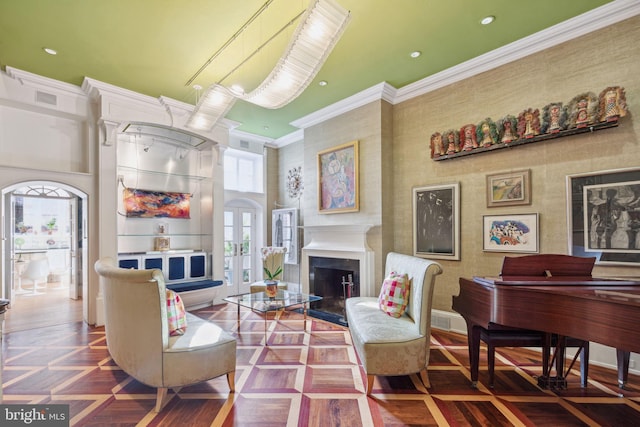 interior space with dark parquet floors, a towering ceiling, and ornamental molding