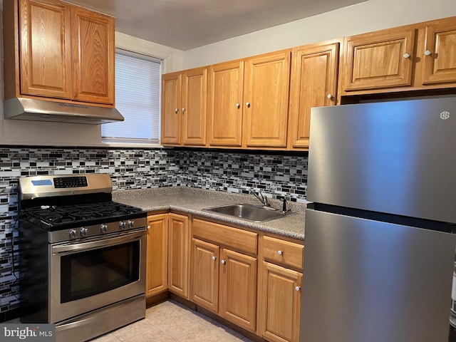 kitchen with light tile floors, backsplash, sink, and stainless steel appliances