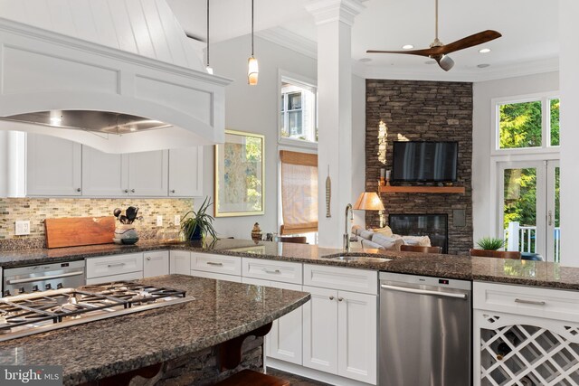 164 W Lake Dr, Annapolis, MD 21403 - kitchen featuring ceiling fan, a fireplace, appliances with stainless steel finishes, sink, and dark stone counters