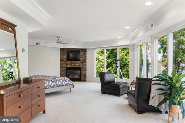 164 W Lake Dr, Annapolis, MD 21403 - carpeted living room featuring a stone fireplace, crown molding, and ceiling fan