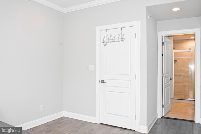 interior space featuring dark hardwood / wood-style floors and ornamental molding