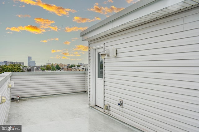 view of side of home featuring a balcony