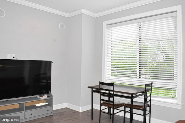 dining area featuring dark hardwood / wood-style floors and ornamental molding