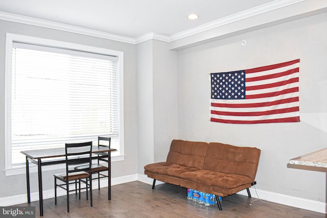 sitting room with crown molding, dark wood-type flooring, and plenty of natural light