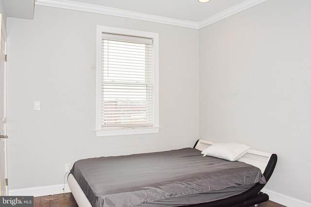 bedroom with dark hardwood / wood-style flooring, multiple windows, and ornamental molding