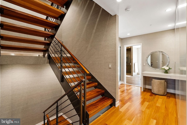 staircase with light wood-type flooring