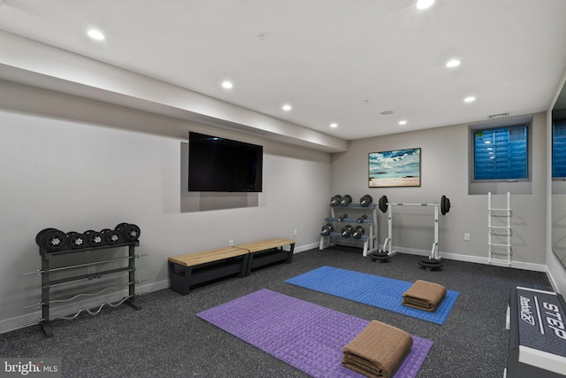 workout area with dark carpet