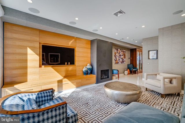 living room featuring a large fireplace