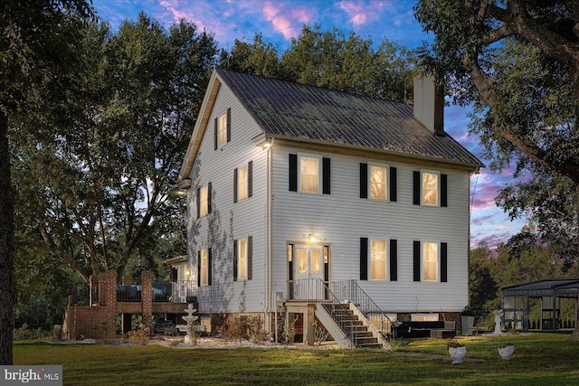 view of front of home with a lawn