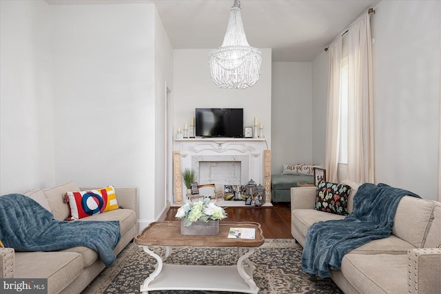 living room with hardwood / wood-style flooring and an inviting chandelier