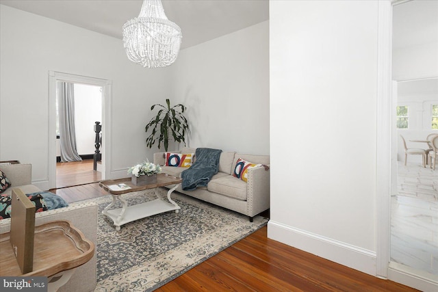 living room featuring hardwood / wood-style floors and a chandelier