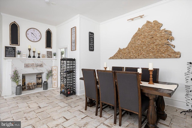 dining space featuring ornamental molding