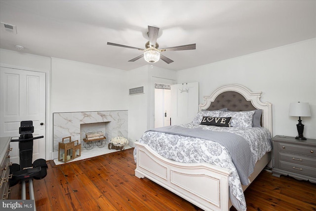 bedroom featuring ceiling fan and dark hardwood / wood-style floors