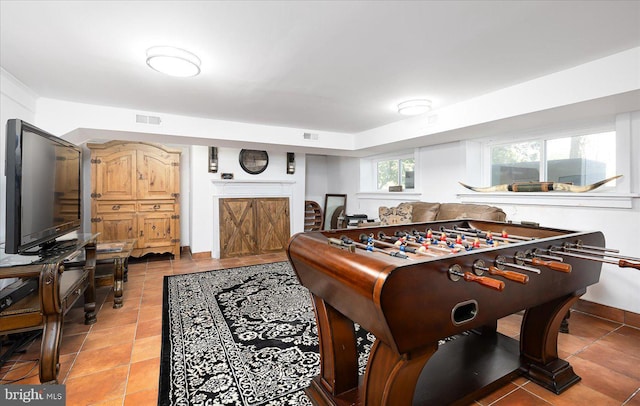 game room featuring tile patterned floors